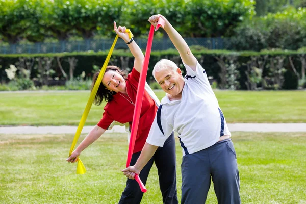 depositphotos_126484210-stock-photo-senior-couple-exercising-with-yoga